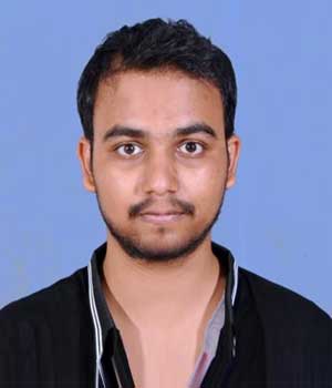 A portrait of Mr. Shivalingayya Gaddimath, an alumnus of the institution, captured in a professional photograph against a neutral backdrop